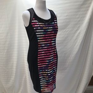 Sleeveless body con dress with vibrant floral print and mesh overlay size M